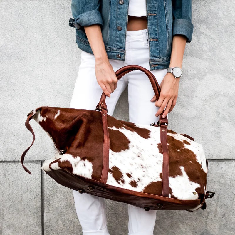 What Is a Hair On Leather Duffle Bag and Why Has the Western Cowhide Aesthetic Become a Travel Fashion&nbsp;Statement?